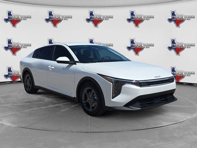 2025 Kia K4 LXS in White — front three-quarter view